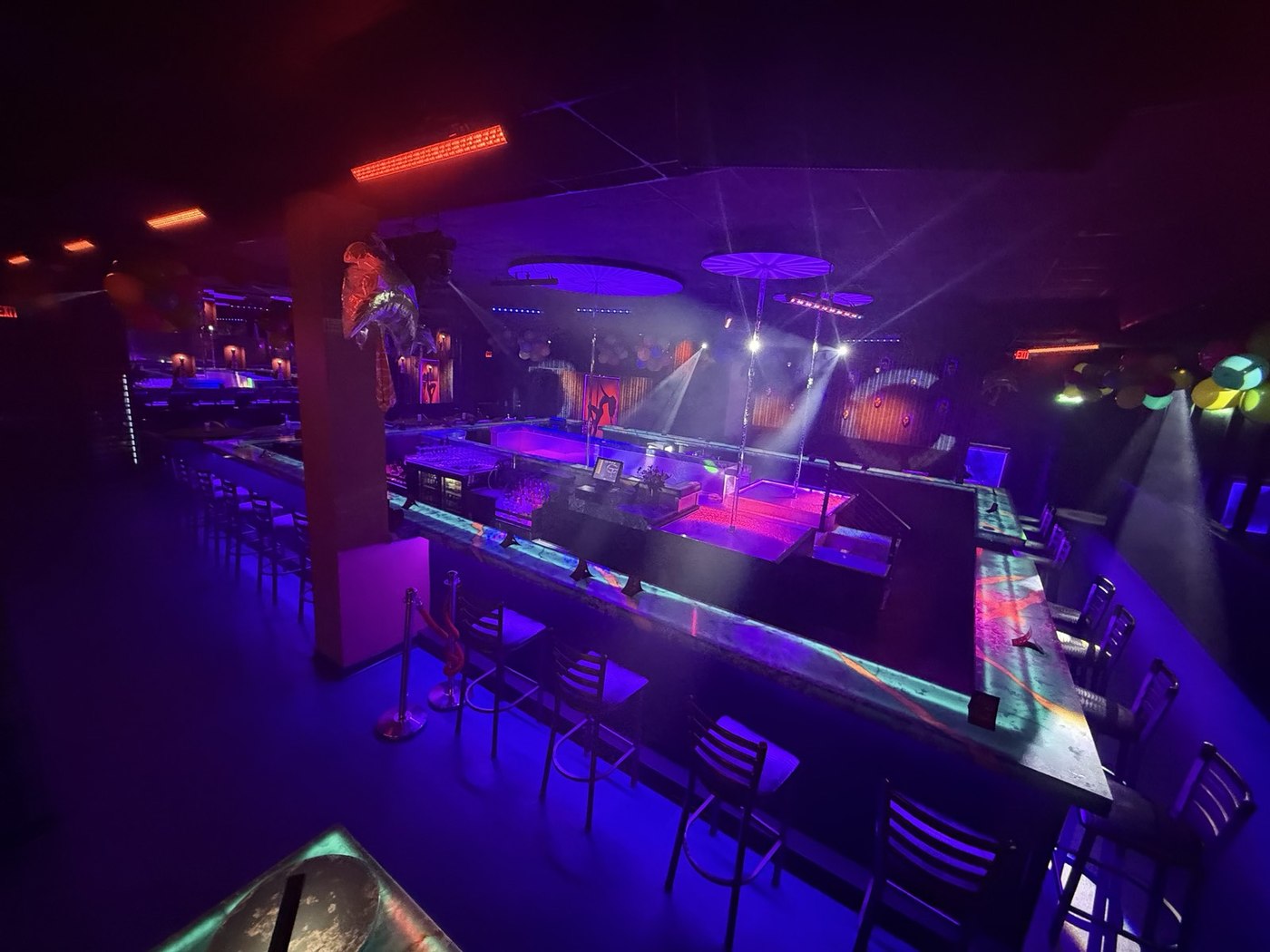 Interior of Lace West Nyack with illuminated bar, seating and stages